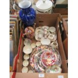 A tray of assorted ceramic ware to include floral decorated items, teapots, plates,