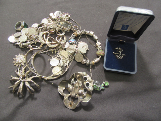 A box containing a quantity of white metal and silver jewellery approx weight 340g