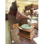 A wind up gramophone CONDITION REPORT: Table revolves when released.