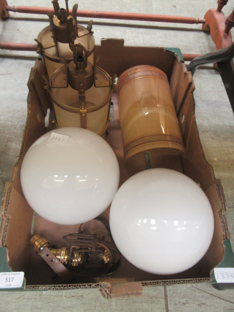 A tray of decorative light fittings and glass balls