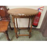 A mid-20th century oval topped oak occasional table