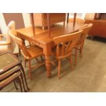A modern pine kitchen table along with a set of four beech kitchen chairs (A/F)