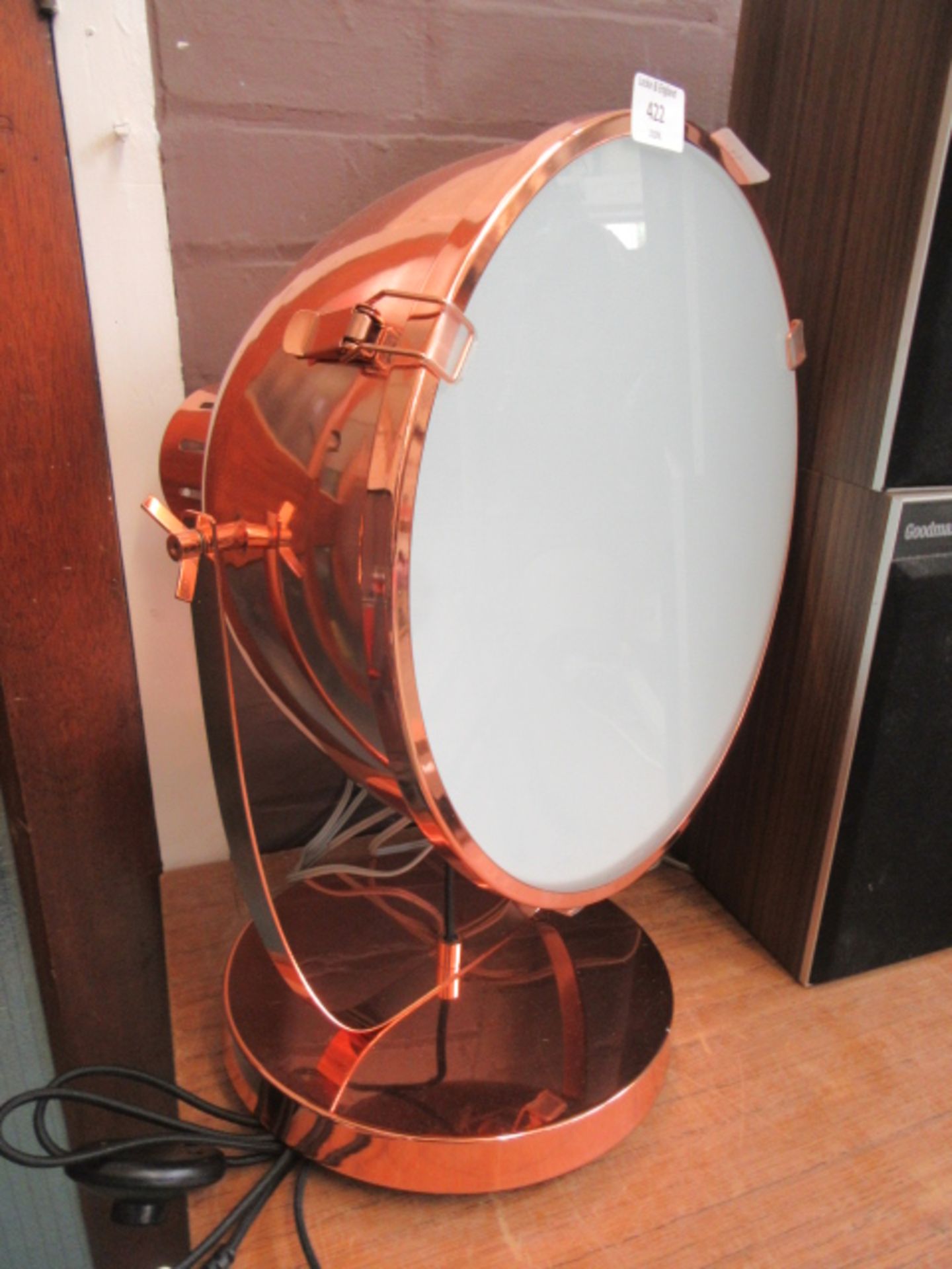 A reproduction copper effect spotlight