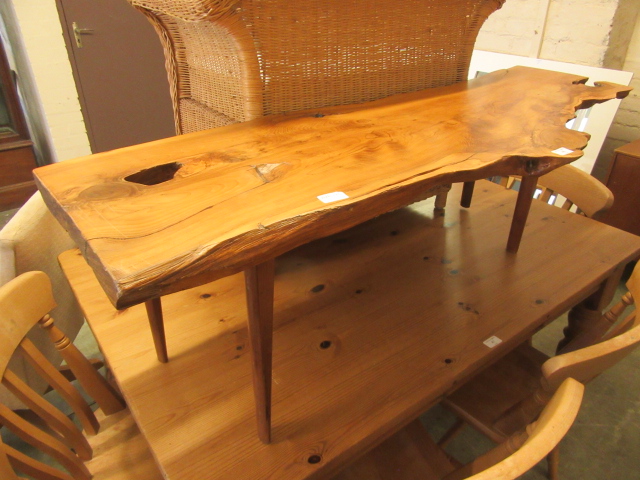 A modern yew coffee table on tapering legs