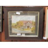 A framed and glazed watercolour of a cottage signed bottom left B.