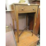 A mid-20th century oak side table with drop leaves and single drawer