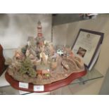 A Lilliput Lane village scene with certificate and box titled 'Out of the Storm' (A/F)