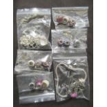 A bag containing Pandora necklaces, charms,