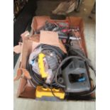 A tray containing a hammer drill, cabling etc.