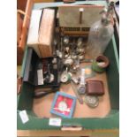 A tray containing a soda siphon, flatware, pocket watches, railway and cottages,