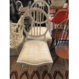 A pair of reproduction grey painted chairs