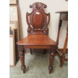 A Victorian mahogany shield back hall chair