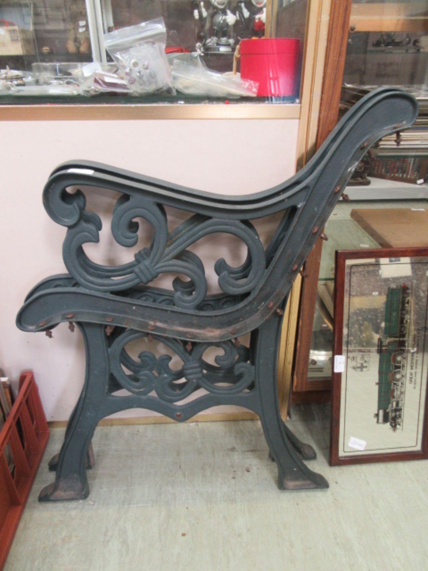 A pair of green painted cast iron bench ends CONDITION REPORT: We do not deal with