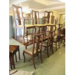 A modern mahogany extending dining table along with a set of six (four plus two) Queen Anne style