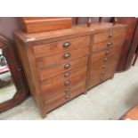 A waxed pine cupboard having two drawers above a pair of cupboard doors