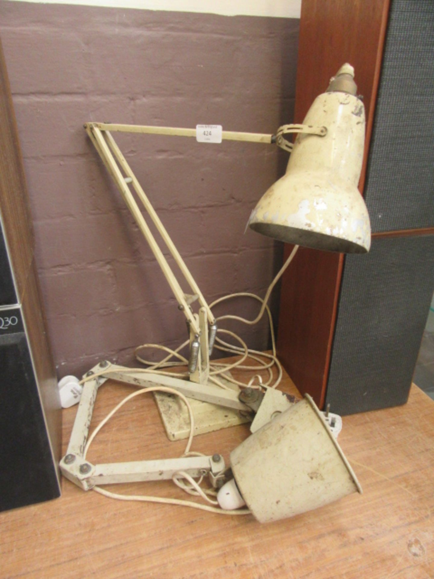 A Herbert Terry and Sons angle poise lamp together with a similarly aged machinist's lamp