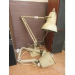 A Herbert Terry and Sons angle poise lamp together with a similarly aged machinist's lamp
