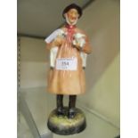 A Royal Doulton figurine of shepherd titled 'Lambing Time' HN1890