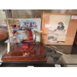 Two boxed children's sewing machines