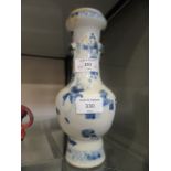 A 19th century Chinese blue and white baluster vase decorated with dancers and objects,