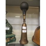 A brass car horn