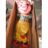 A boxed Pelham Puppet in the form of a pig CONDITION REPORT: Slight damage to