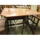 A walnut drop leaf table