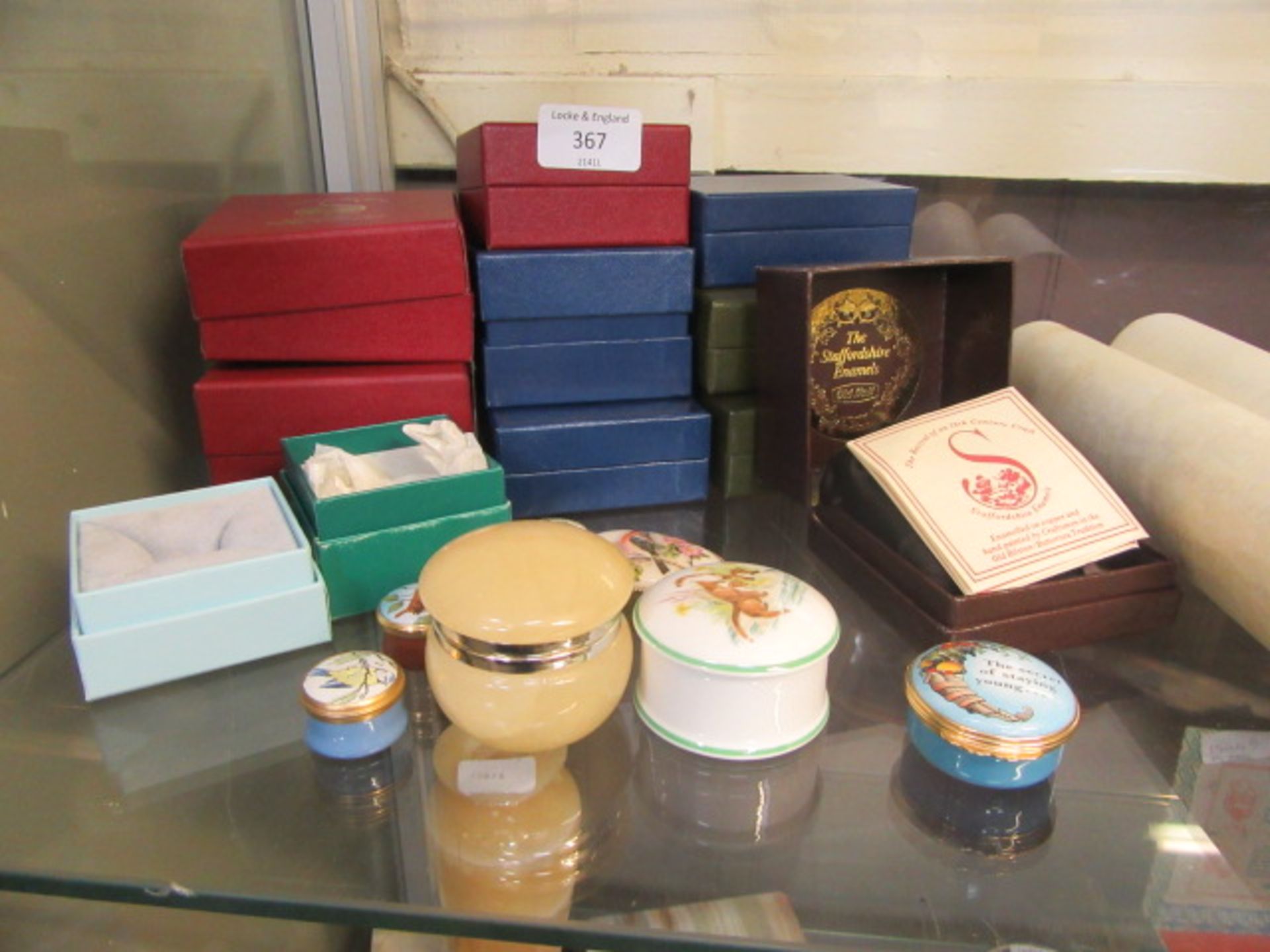 A selection of ceramic and other enamel trinket boxes