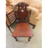 A Victorian mahogany shield back hall chair