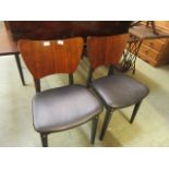 A pair of mid-20th century dining chairs