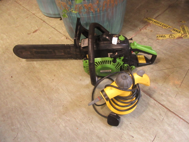 A petrol chainsaw together with a steam cleaner