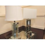 Two mirrored table lamps with shades