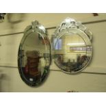 Two decorative wall mirrors