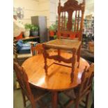 A modern pine circular dining table together with a set of four seagrass seated matching chairs