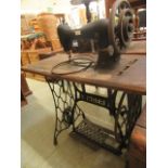 A Singer leather sewing machine, model number '45 K 1' on treadle base, h.