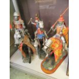 Three hand crafted knights in armor