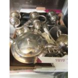 A box containing an assortment of plated ware to include candelabra, teapot, flatware, cream jug,