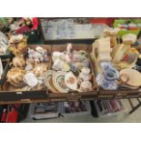 three trays of decorative ceramic ware to include coofee and tea pots, clocks, vases etc.