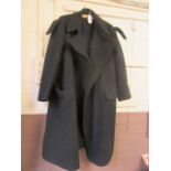 A navy blue trench coat with military lapels