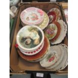Three trays of decorative plates and wall plates of various designs