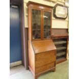 An Edwardian mahogany inlaid bureau bookcase (A/F)