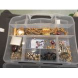 A box containing costume jewellery, beads, pocket watch etc.