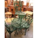 A green painted aluminium garden table with a set of four matching chairs