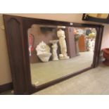 A mahogany framed over mantle mirror