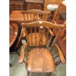 A pair of reproduction open arm Windsor chairs