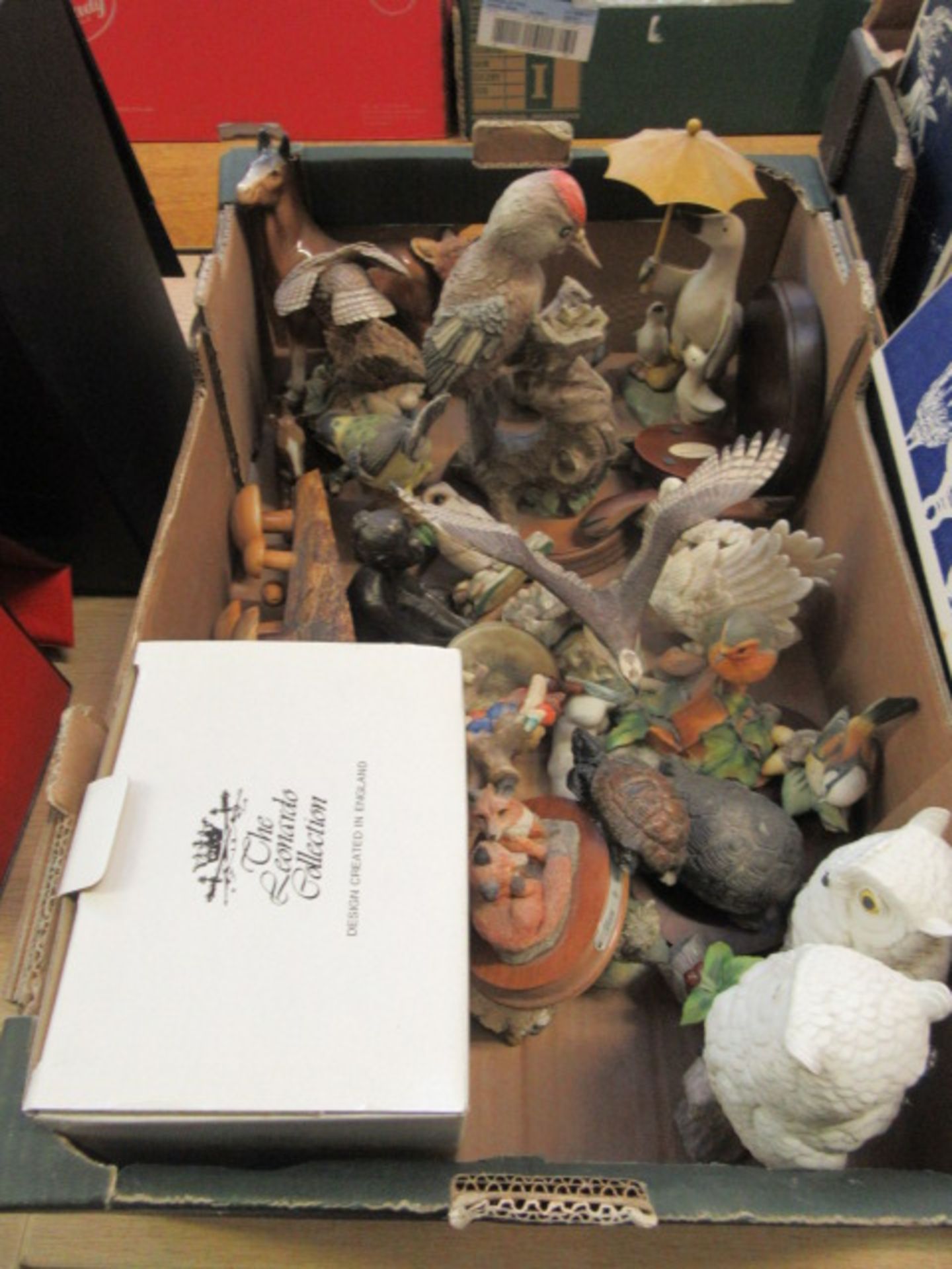 A tray containing a large selection of bird ornaments etc.