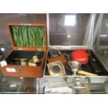 A hinged box containing opera glasses, whistle, match boxes, etc,