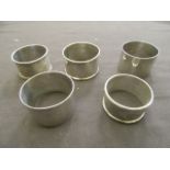Five assorted silver napkin rings weighing approximately 137g