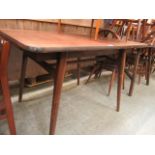 A mid-20th century teak dining table