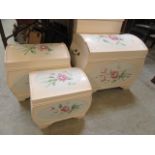 Three reproduction floral decorated dome topped storage boxes
